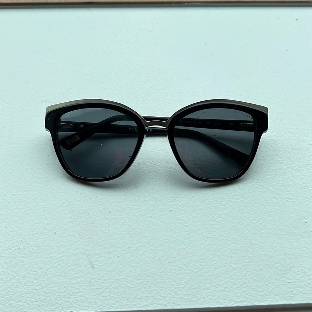 Ted Baker black and gold sunglasses.